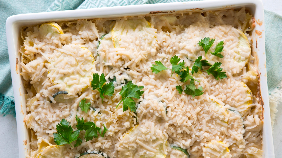 Casserole dish filled with Two-Cheese Vegetable-Alfredo Pasta Bake.