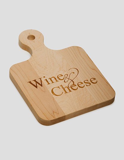 Cutting Board with the words "Wine & Cheese" etched onto it.