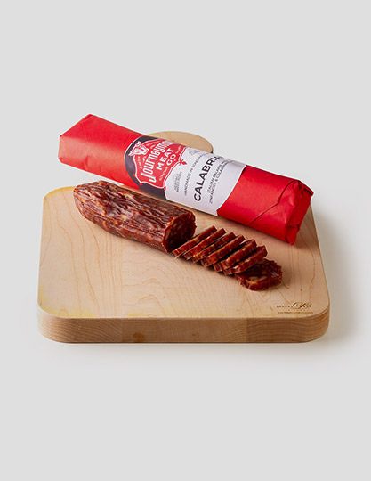 Calabrian Salami sliced on a cutting board.